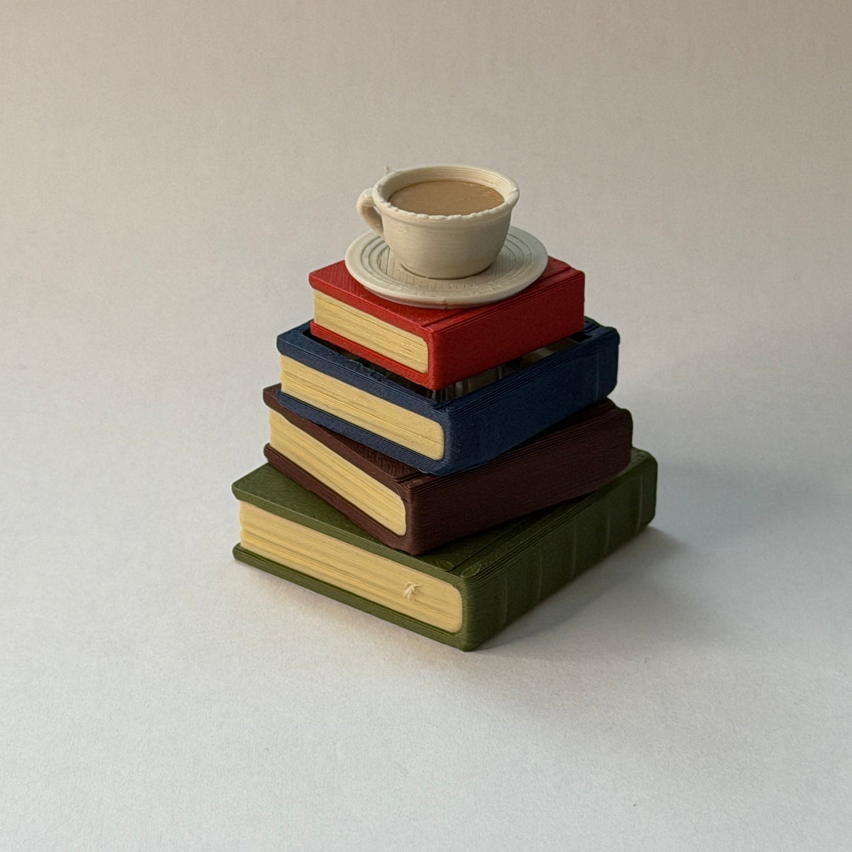 Teacup book stack clicker - Aged