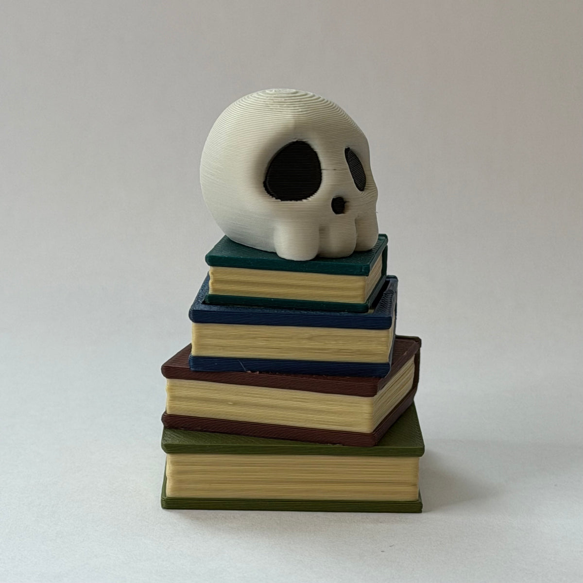 Skull book stack clicker - Aged
